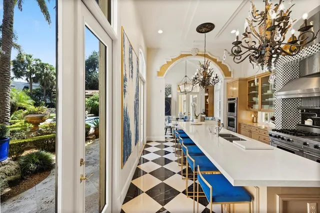 a living room with furniture and large window