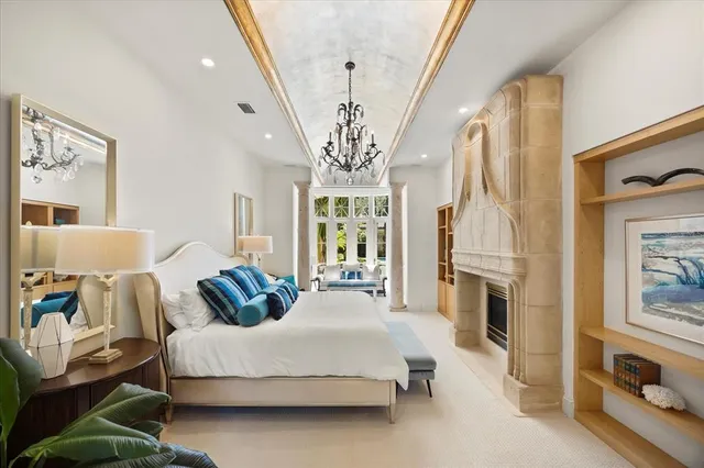 a view of a kitchen with a sink and dishwasher with white cabinets