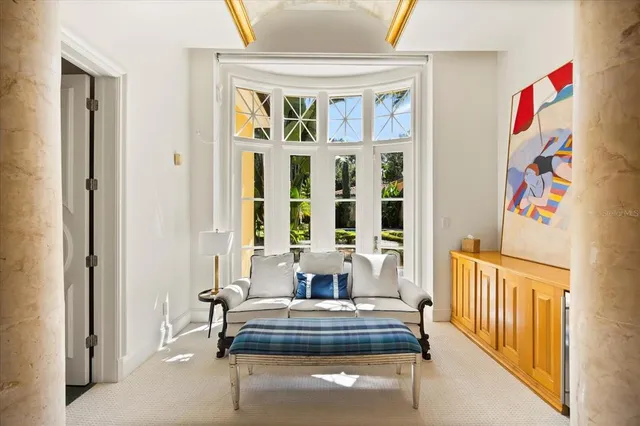 a view of walk in closet and bedroom