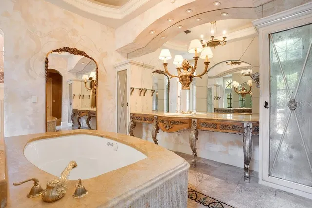 a view of a porch with furniture and backyard