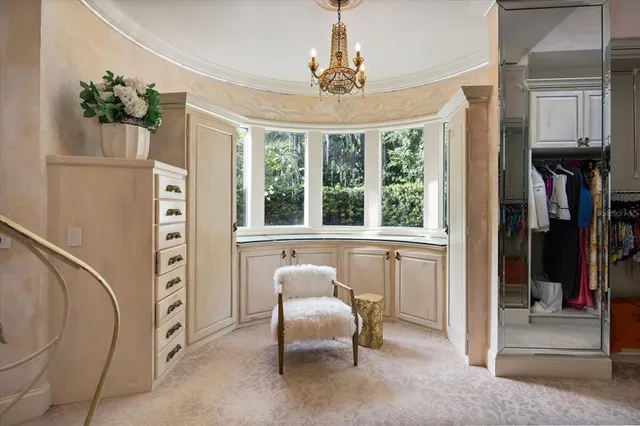 a view of a house with swimming pool and sitting area