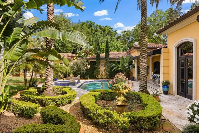 an aerial view of ocean with residential house with outdoor space
