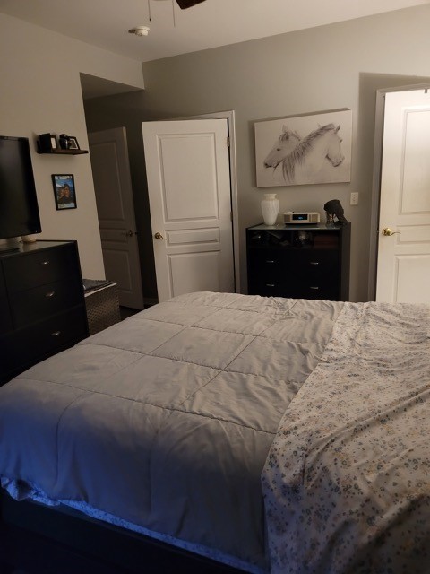 503 Metropolitan Street, Unit 503 Aurora, IL 60502 - Photo 16 of 24 a bedroom with a bed and a refrigerator