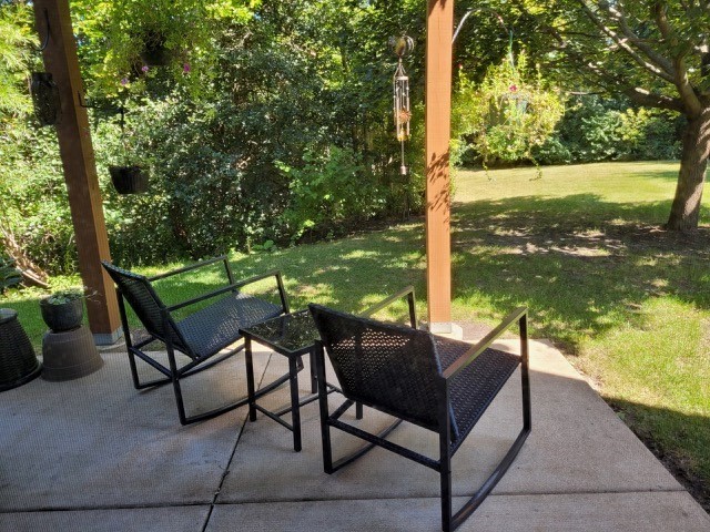 503 Metropolitan Street, Unit 503 Aurora, IL 60502 - Photo 22 of 24 a view of a chairs and table in the patio