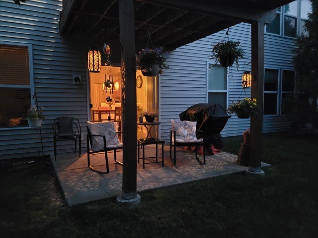 503 Metropolitan Street, Unit 503 Aurora, IL 60502 - Photo 24 of 24 a view of a porch with chairs and a potted plant