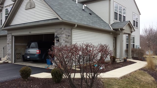503 Metropolitan Street, Unit 503 Aurora, IL 60502 - Photo 3 of 24 a view of a house with a yard and pathway