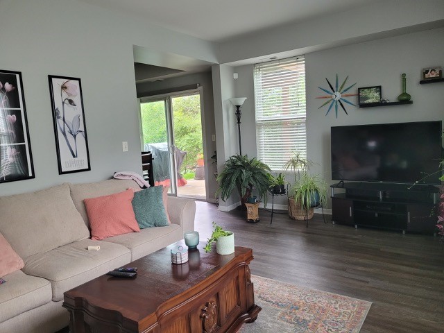 503 Metropolitan Street, Unit 503 Aurora, IL 60502 - Photo 7 of 24 a living room with furniture fireplace and window