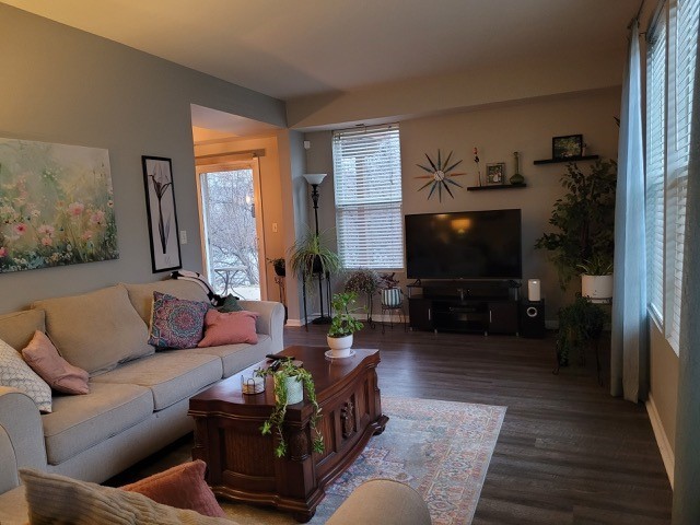 503 Metropolitan Street, Unit 503 Aurora, IL 60502 - Photo 8 of 24 a living room with furniture and a flat screen tv