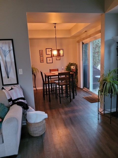 503 Metropolitan Street, Unit 503 Aurora, IL 60502 - Photo 9 of 24 a view of a dining room with furniture window and wooden floor