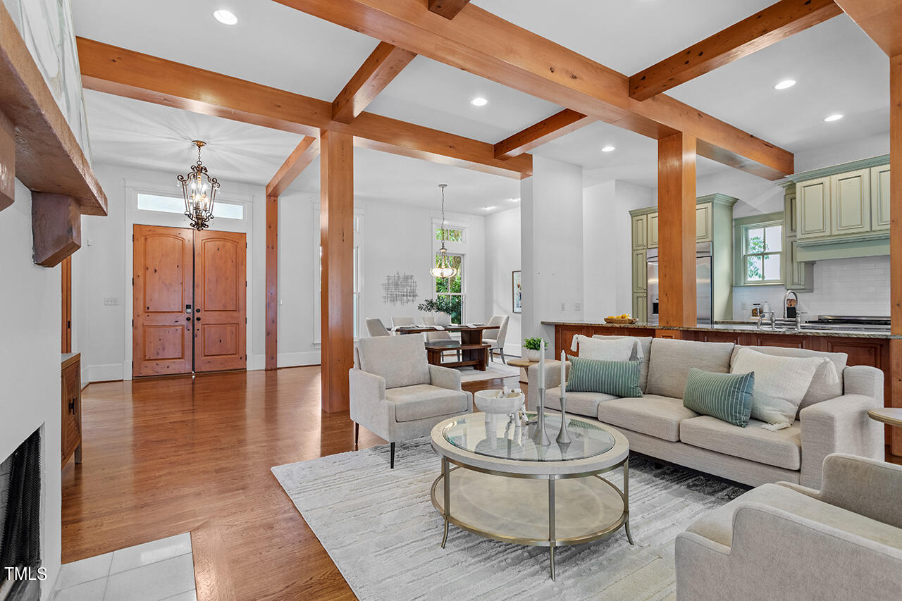 2000 Greyhawk Place Apex, NC 27539 - Photo 11 of 59 a living room with furniture and a large window
