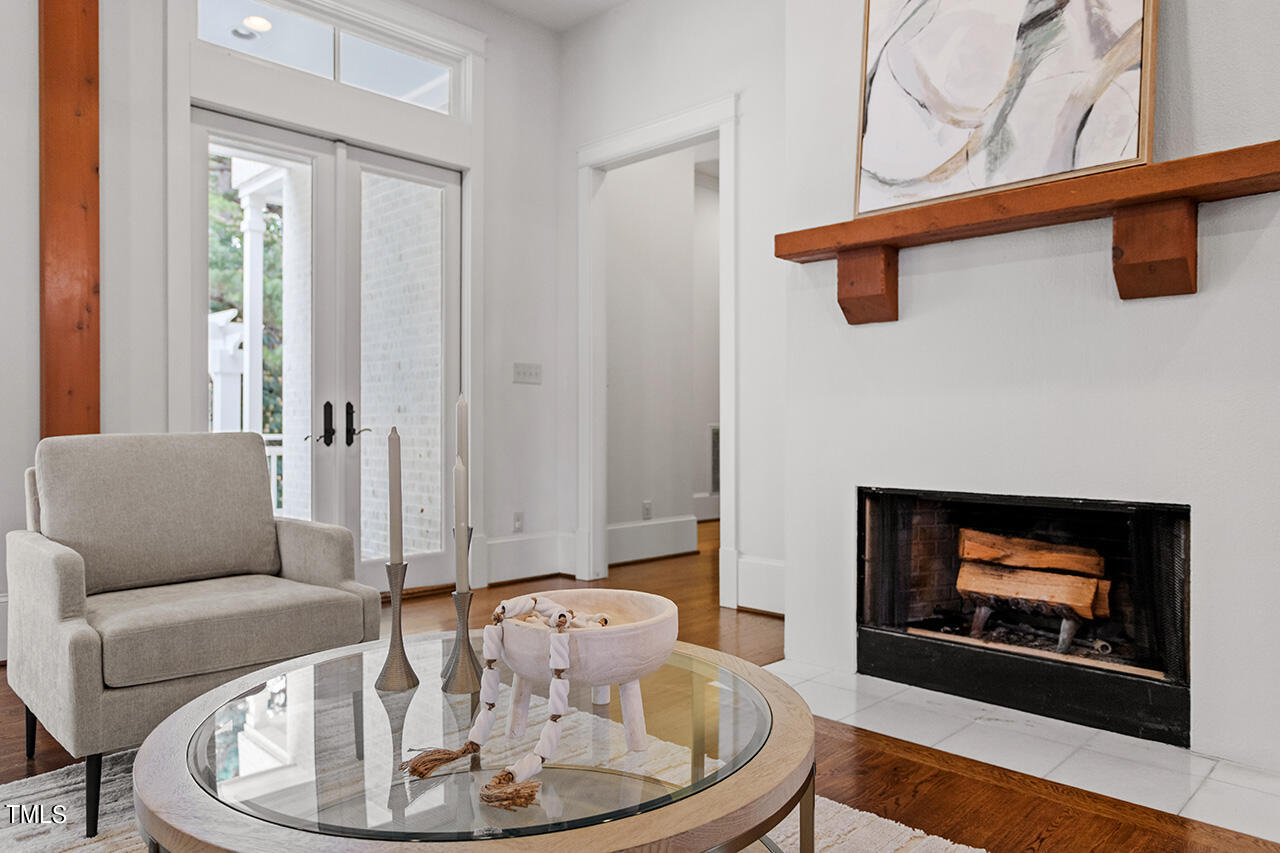 2000 Greyhawk Place Apex, NC 27539 - Photo 16 of 59 a living room with furniture and a fireplace