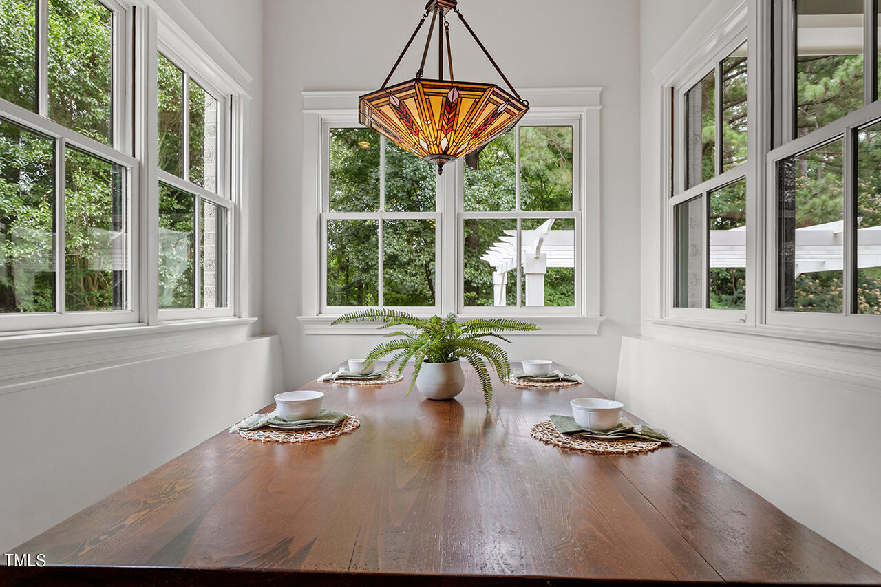 2000 Greyhawk Place Apex, NC 27539 - Photo 18 of 59 a view of a dining room with furniture window and outside view
