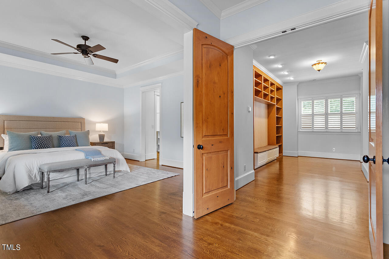 2000 Greyhawk Place Apex, NC 27539 - Photo 25 of 59 a spacious bedroom with a bed and glass door