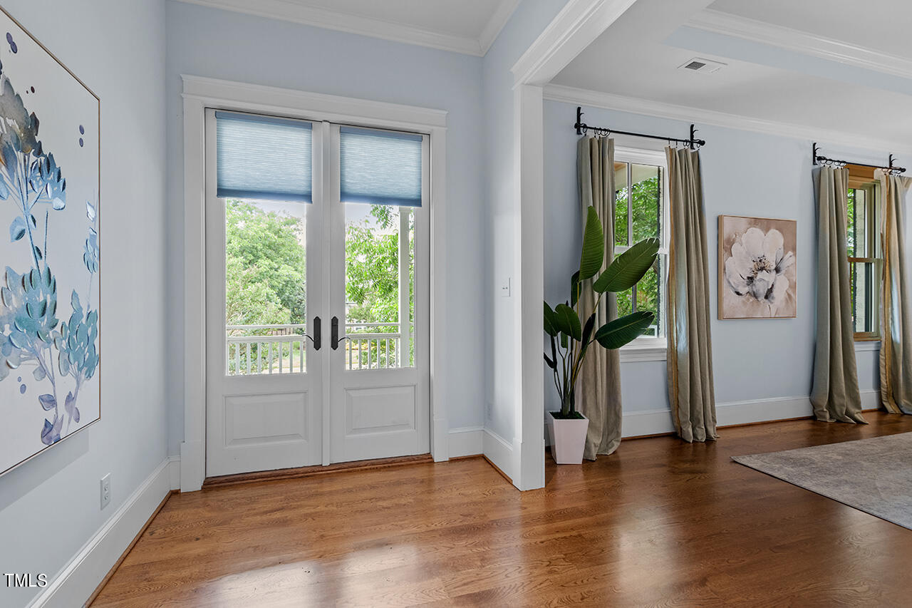 2000 Greyhawk Place Apex, NC 27539 - Photo 26 of 59 a view of empty room with wooden floor and fan