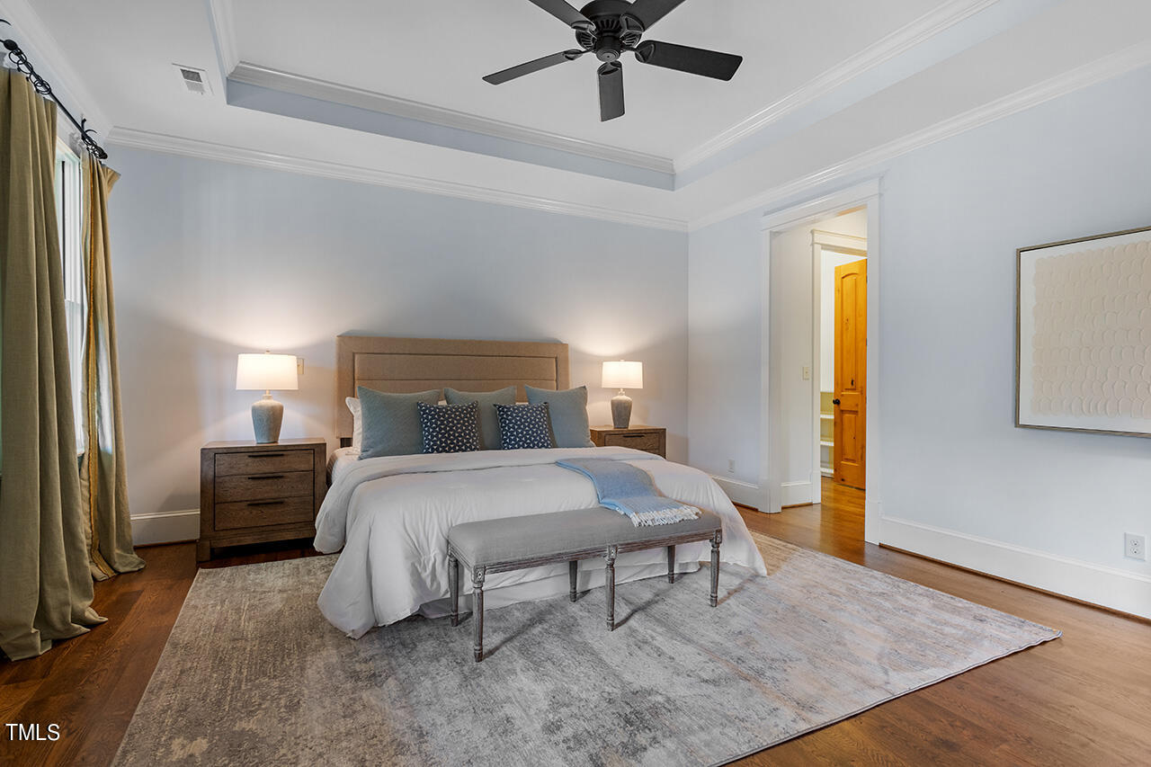 2000 Greyhawk Place Apex, NC 27539 - Photo 27 of 59 a bedroom with a bed and a table