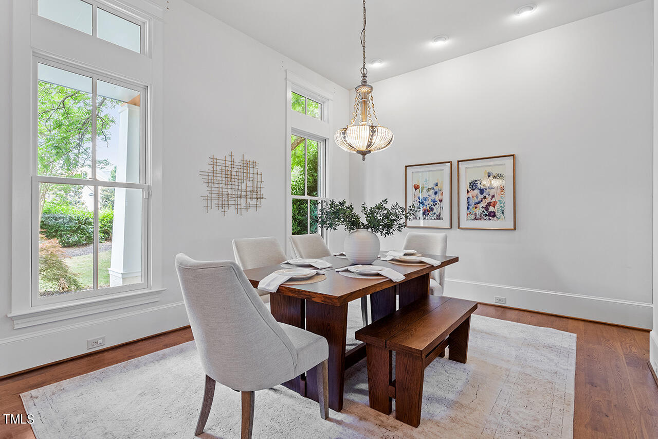 2000 Greyhawk Place Apex, NC 27539 - Photo 3 of 59 a view of a dining room with furniture window and outside view