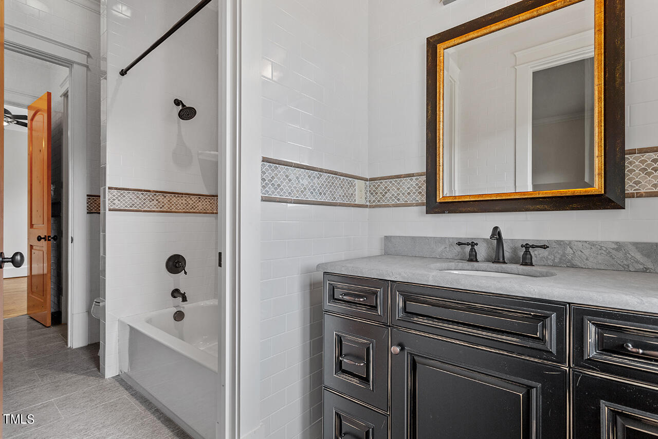 2000 Greyhawk Place Apex, NC 27539 - Photo 45 of 59 a bathroom with a bathtub and a sink