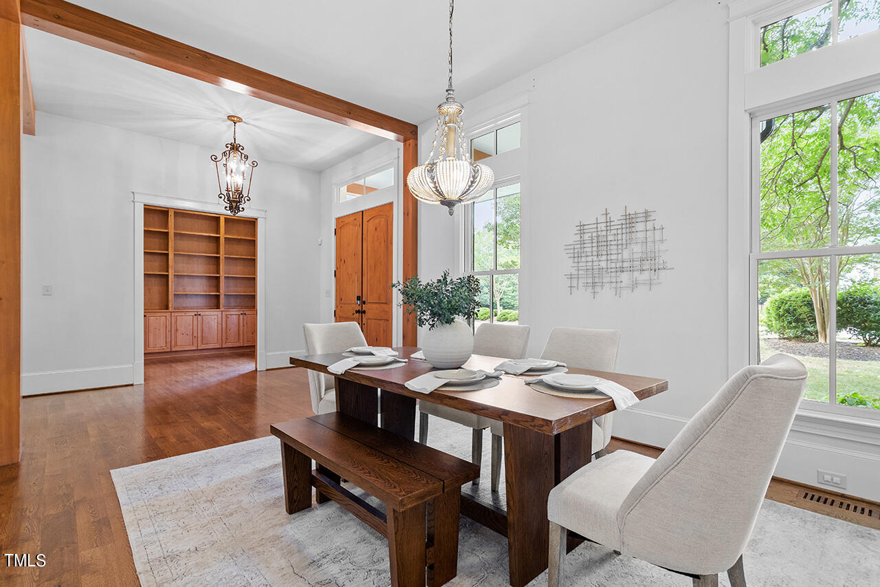 2000 Greyhawk Place Apex, NC 27539 - Photo 5 of 59 a view of a dining room with furniture window and wooden floor
