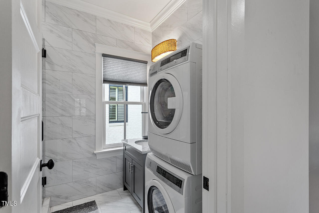 2000 Greyhawk Place Apex, NC 27539 - Photo 57 of 59 a utility room with dryer and washer