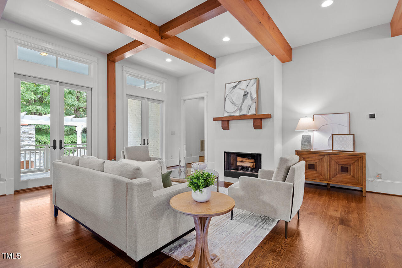 2000 Greyhawk Place Apex, NC 27539 - Photo 6 of 59 a living room with furniture and a fireplace