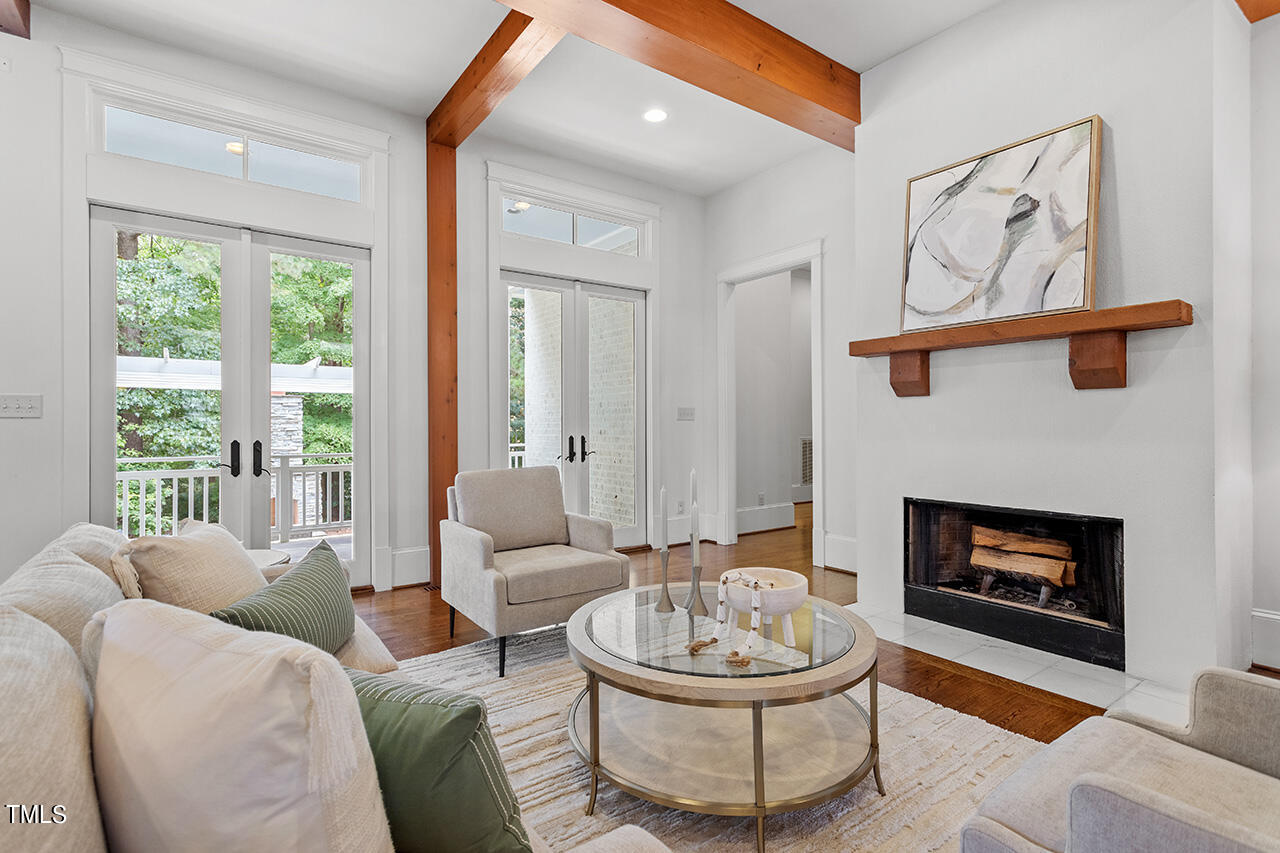 2000 Greyhawk Place Apex, NC 27539 - Photo 7 of 59 a living room with furniture and a fireplace