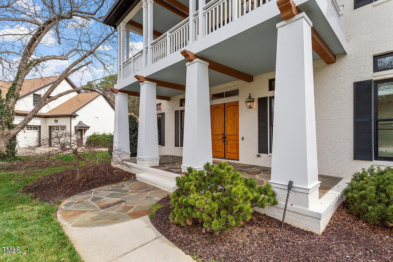 2000 Greyhawk Place Apex, NC 27539 - Photo 8 of 59 a front view of a house with garden