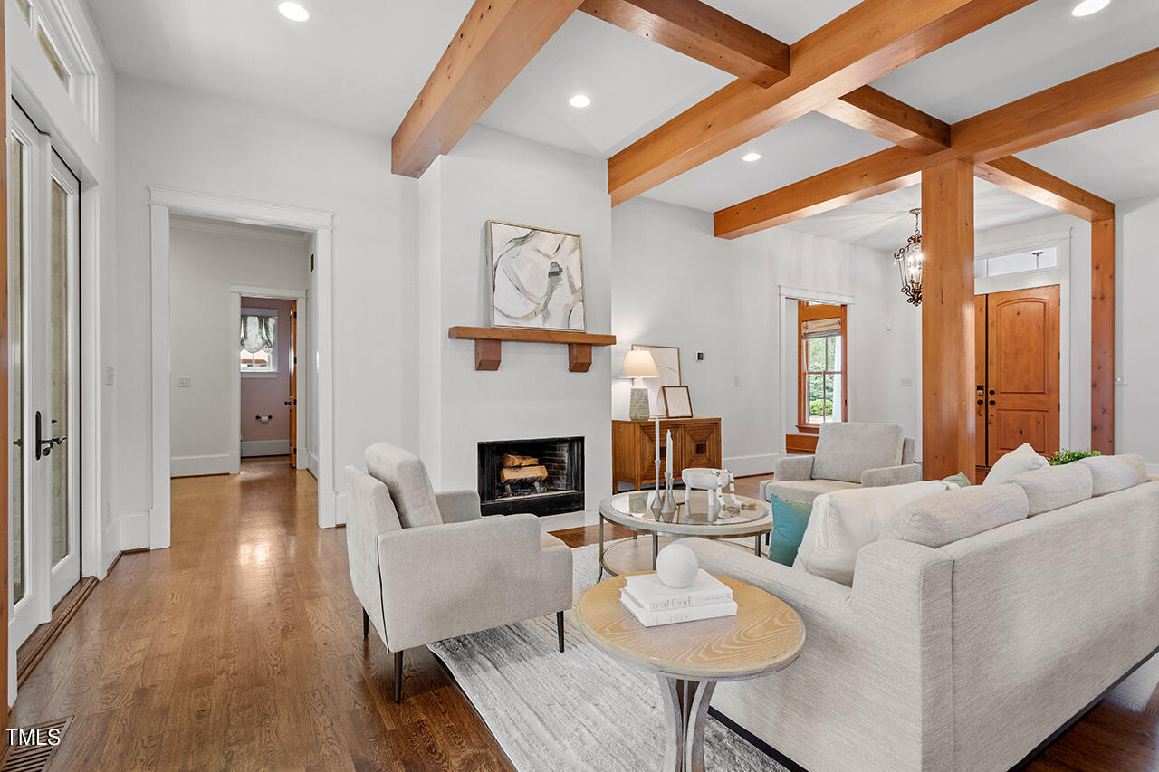 2000 Greyhawk Place Apex, NC 27539 - Photo 9 of 59 a living room with furniture fireplace and a large window