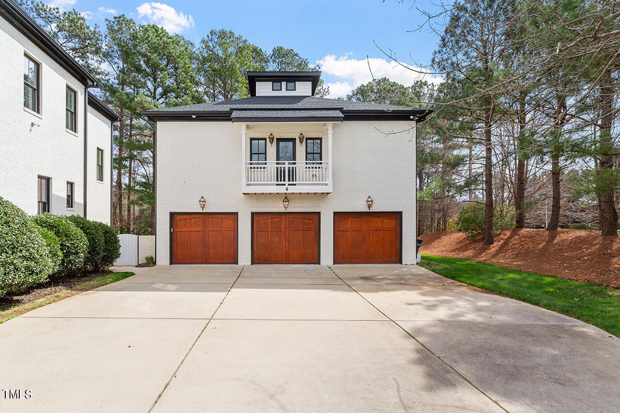 2000 Greyhawk Place Apex, NC 27539 - Photo 10 of 59 a front view of a house with a garden