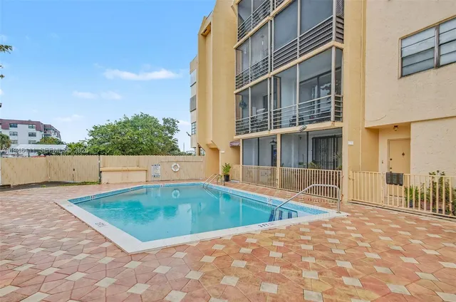 a view of a swimming pool with a lounge chairs