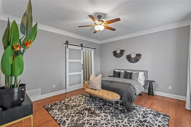 a bedroom with a bed and a rug