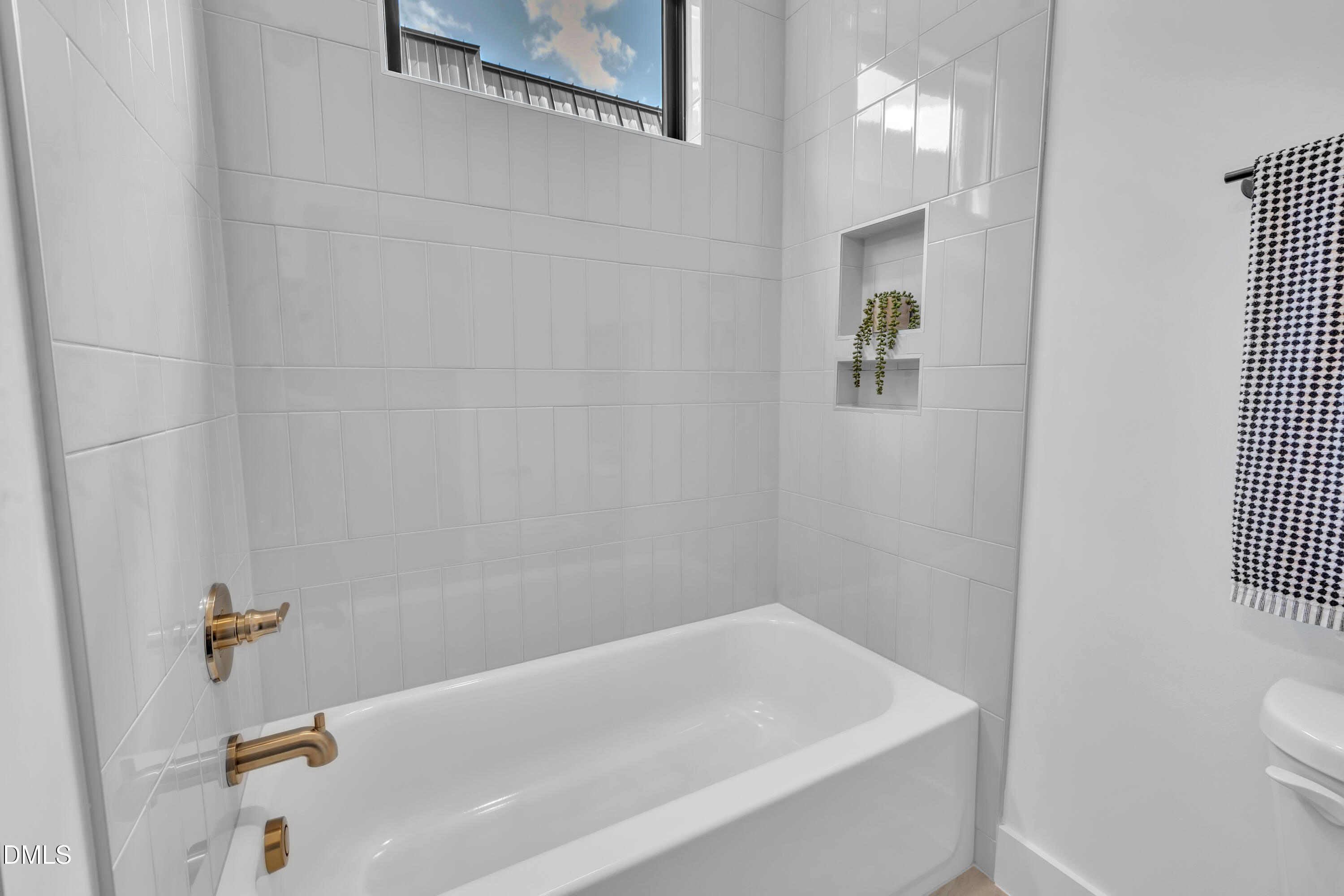 512 Gordon Street, Unit 304 Durham, NC 27701 - Photo 15 of 30 a bath tub sitting next to a white toilet