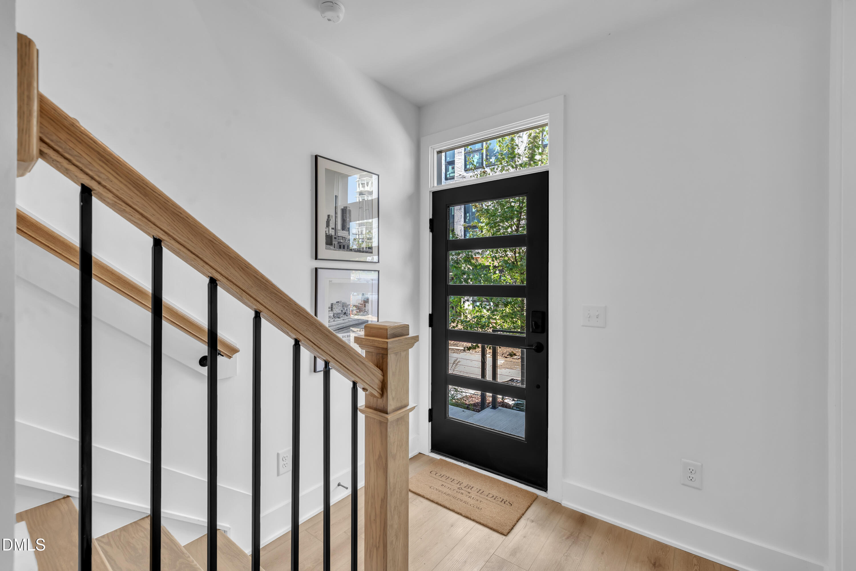 512 Gordon Street, Unit 304 Durham, NC 27701 - Photo 4 of 30 a view of an entryway with wooden floor and door