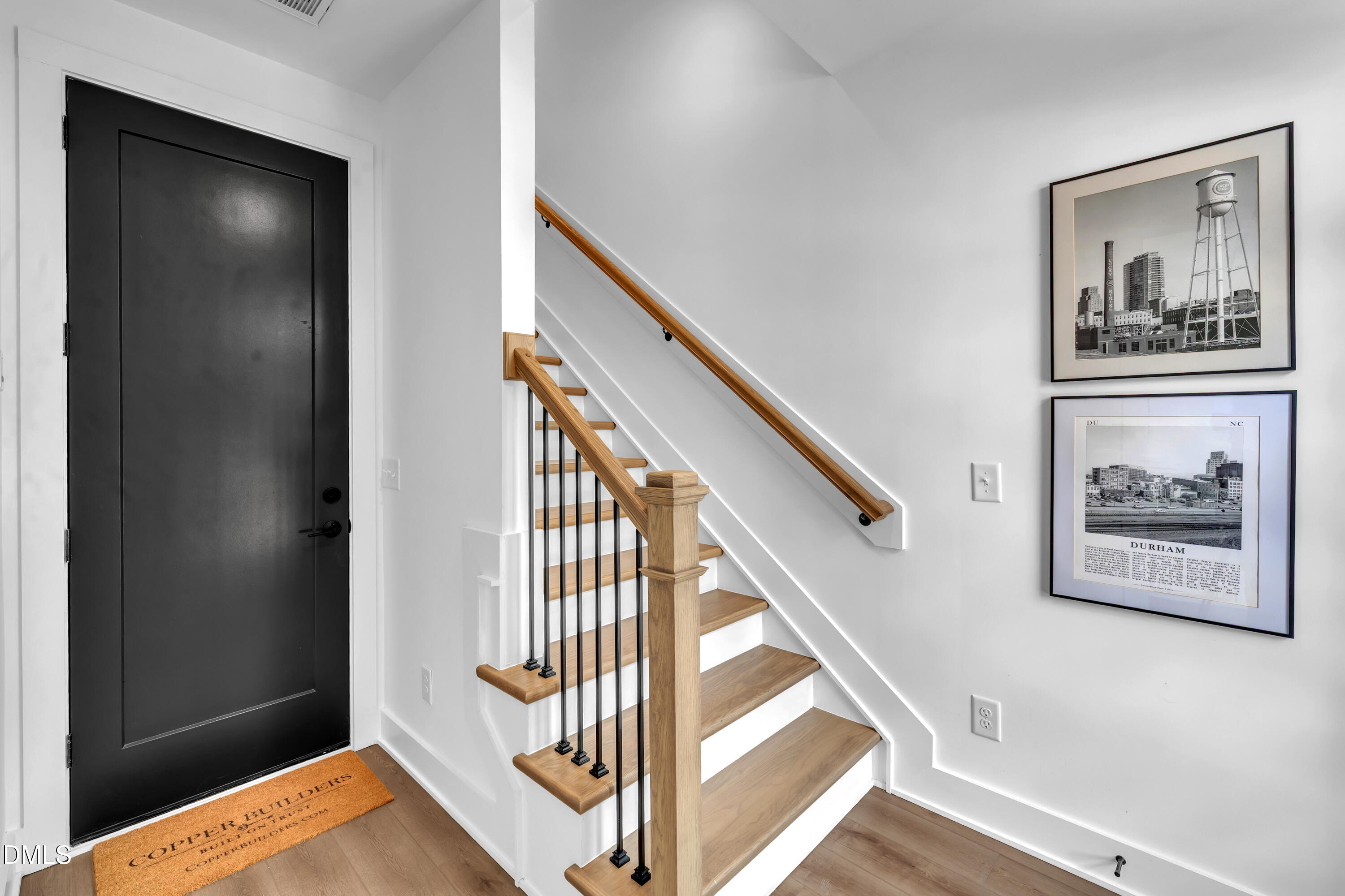512 Gordon Street, Unit 304 Durham, NC 27701 - Photo 8 of 30 a view of a hallway with wooden floor and stairs