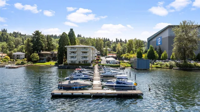 a view of a lake with a car park in front of it
