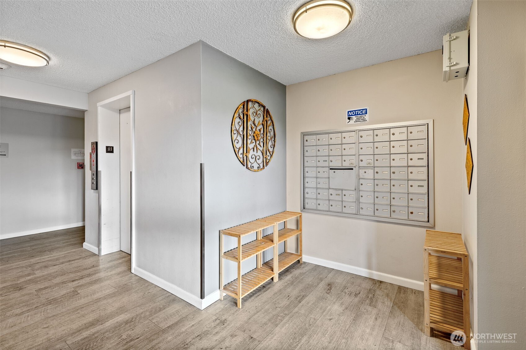 5021 Ripley Lane North, Unit 212 Renton, WA 98056 - Photo 23 of 34 a view of an empty room with wooden floor and a window