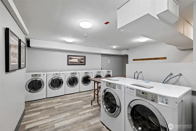 a utility room with dryer washer and dryer