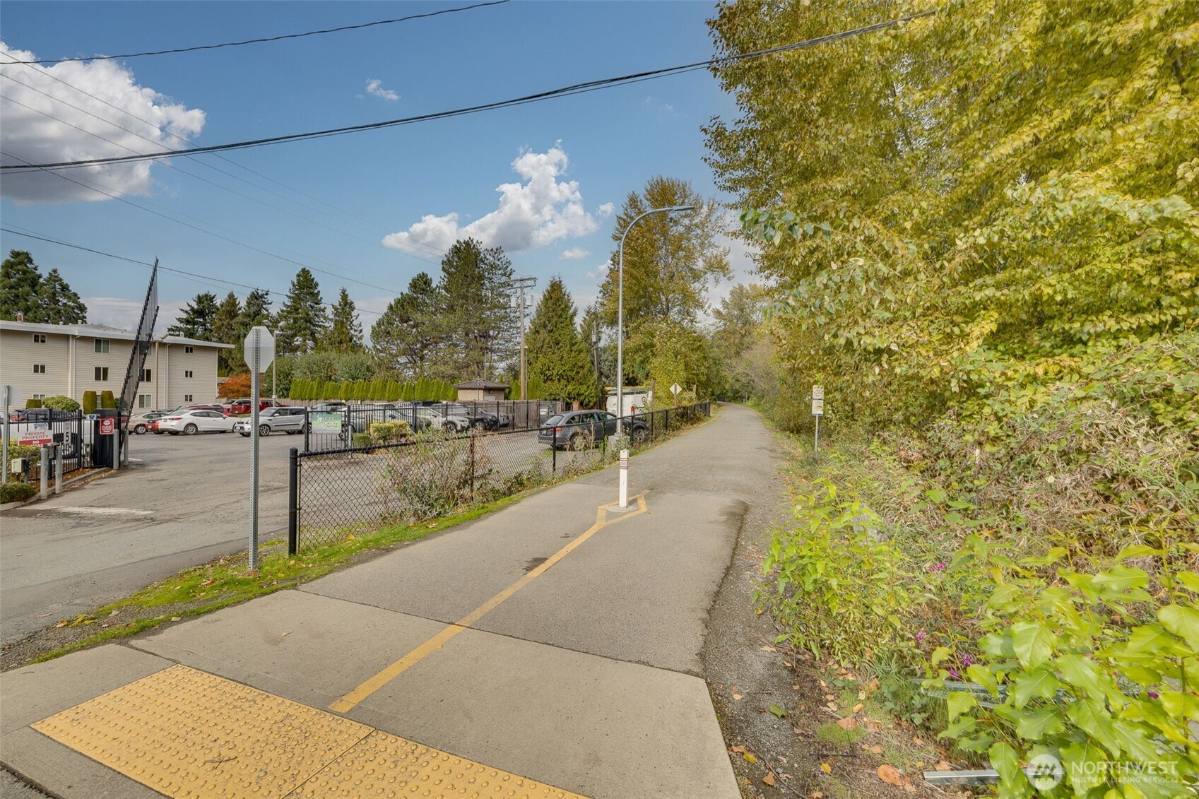 5021 Ripley Lane North, Unit 212 Renton, WA 98056 - Photo 27 of 34 a view of a pathway both side of building