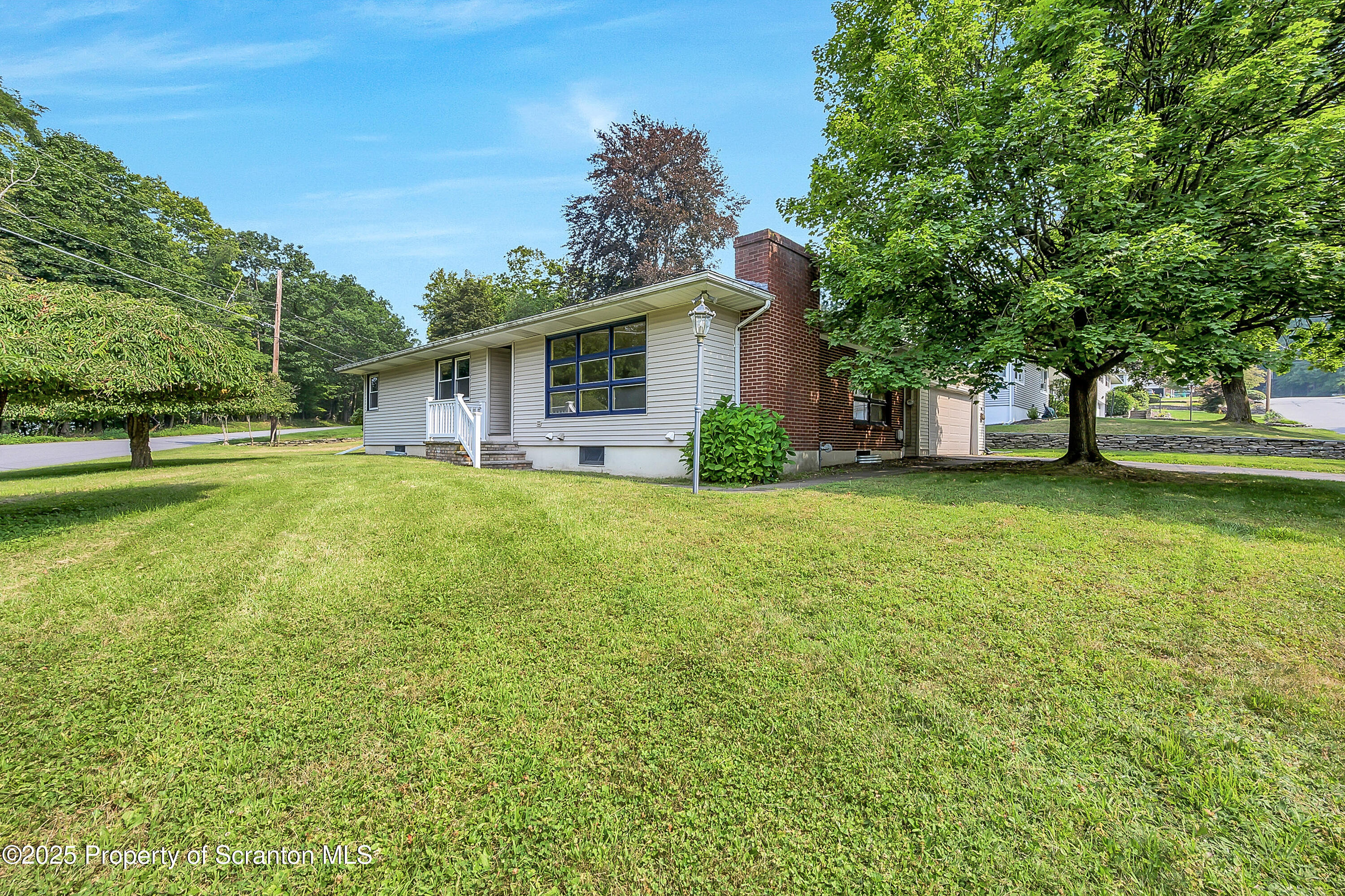 101 Old Post Road Clarks Summit, PA 18411 - Photo 1 of 48 a view of a house with a big yard and large trees