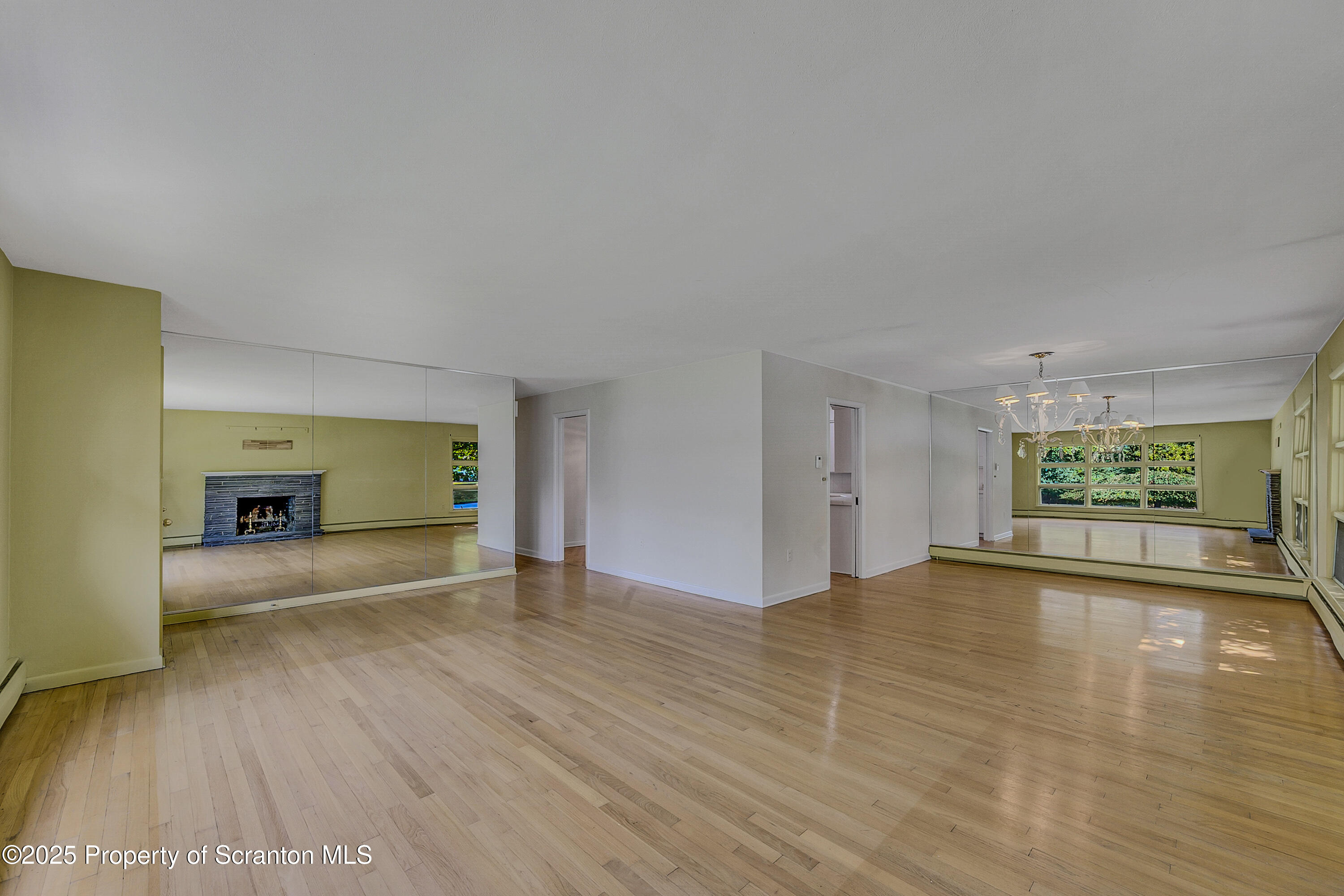 101 Old Post Road Clarks Summit, PA 18411 - Photo 11 of 48 a view of an empty room with a window and wooden floor