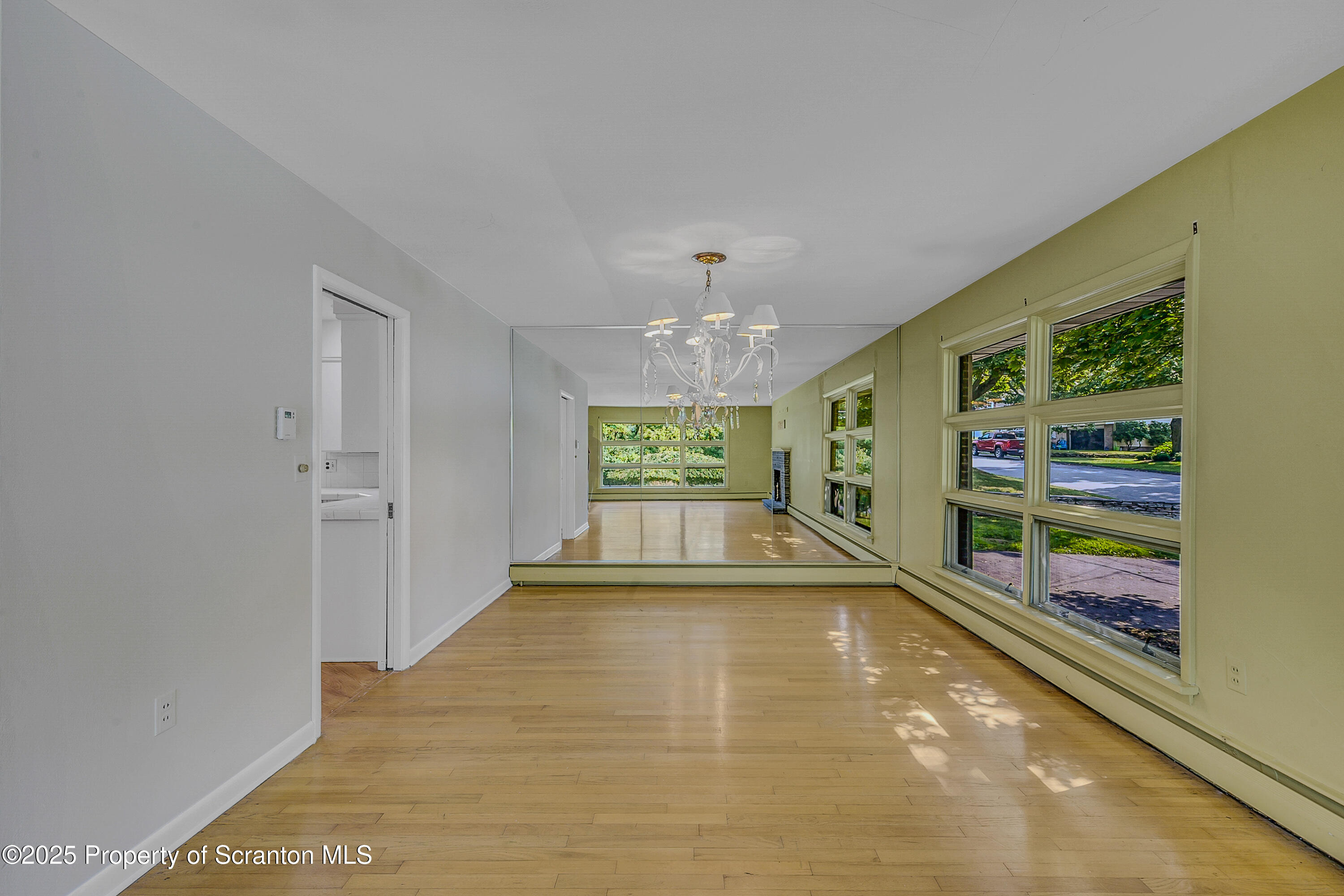 101 Old Post Road Clarks Summit, PA 18411 - Photo 12 of 48 wooden floor in an empty room with a window