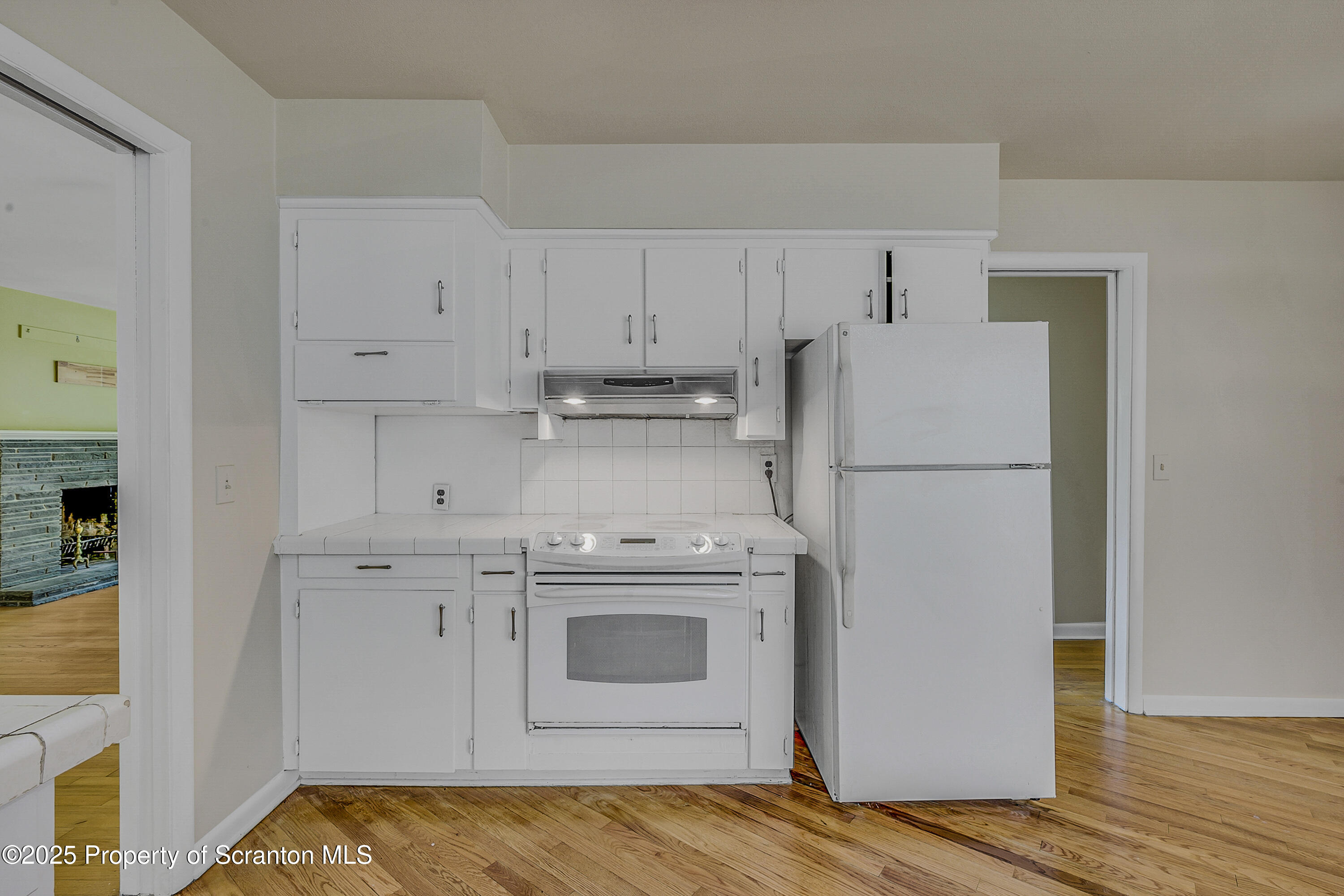 101 Old Post Road Clarks Summit, PA 18411 - Photo 21 of 48 a kitchen with cabinets a refrigerator and a stove