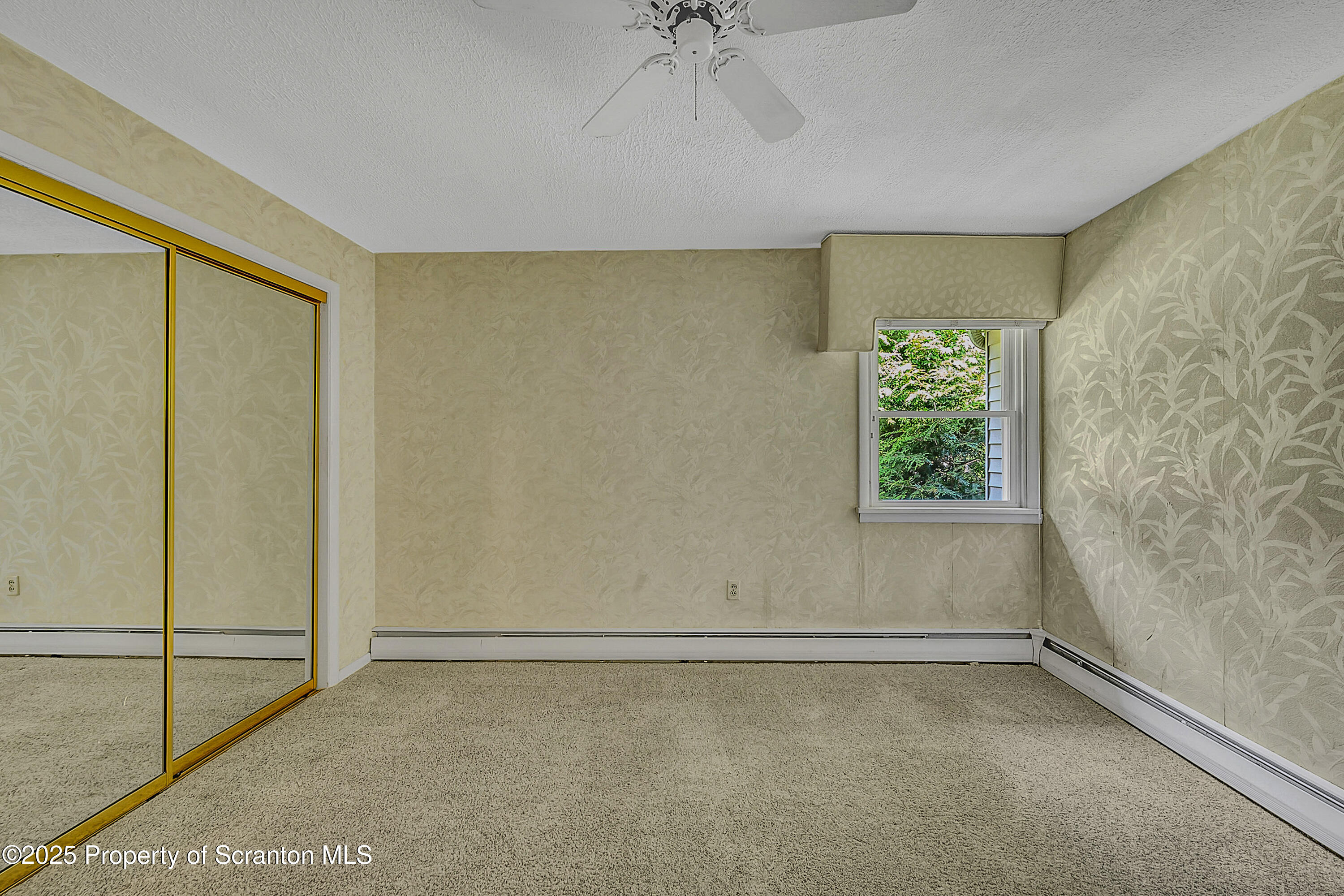 101 Old Post Road Clarks Summit, PA 18411 - Photo 22 of 48 an empty room with a ceiling fan and a window