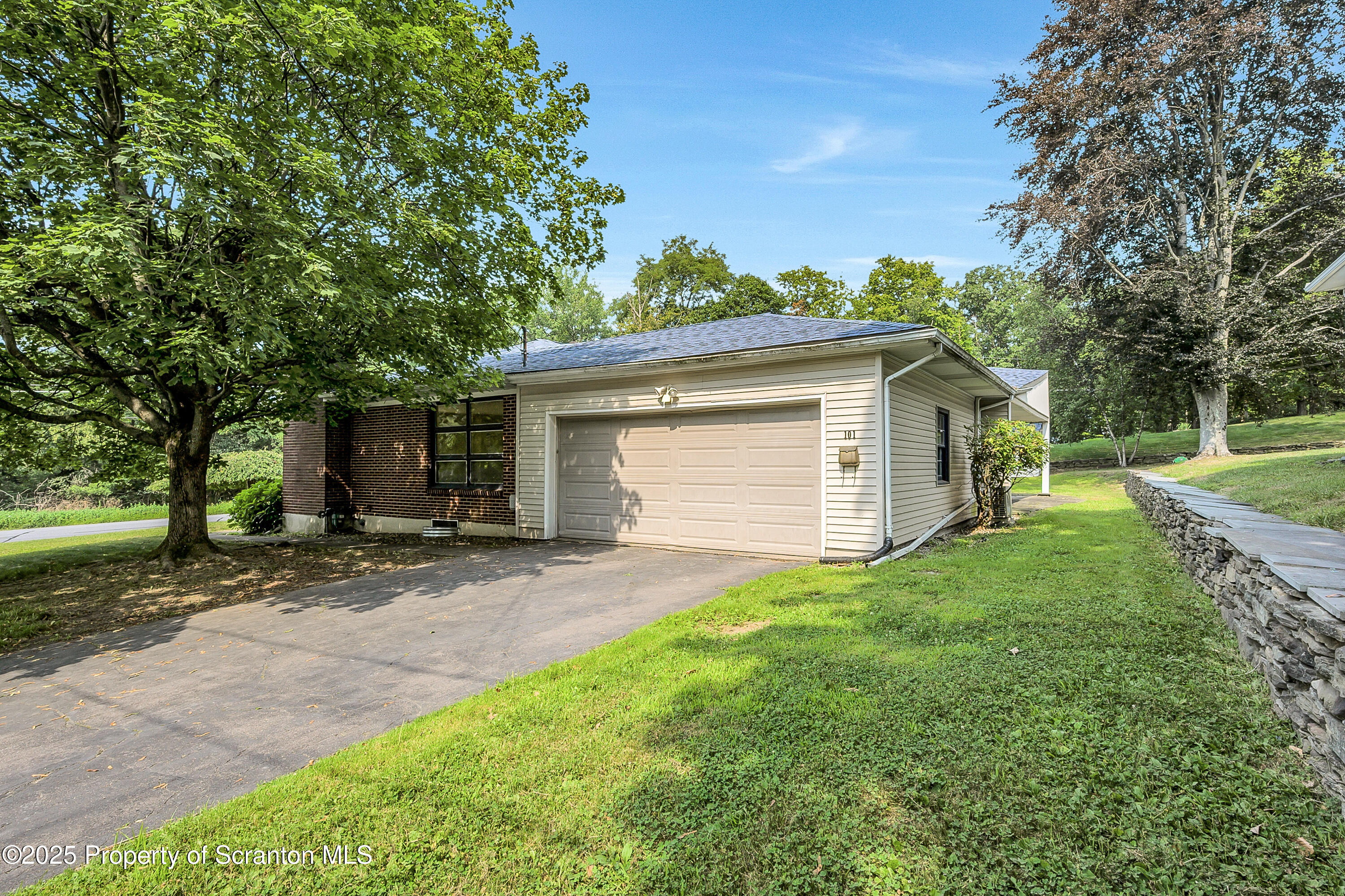 101 Old Post Road Clarks Summit, PA 18411 - Photo 3 of 48 a view of a yard with a house and a large tree