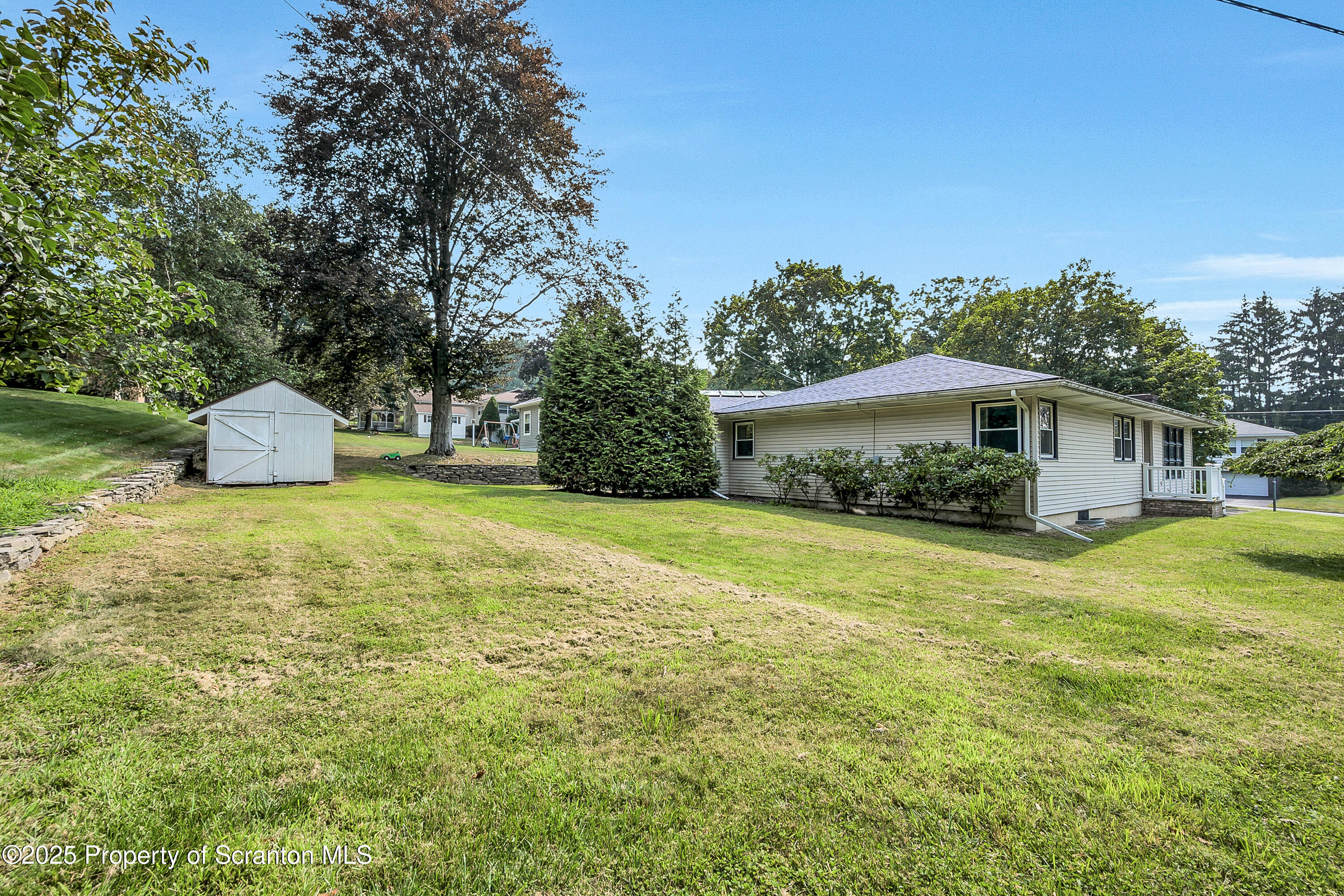 101 Old Post Road Clarks Summit, PA 18411 - Photo 47 of 48 a front view of house with yard and trees