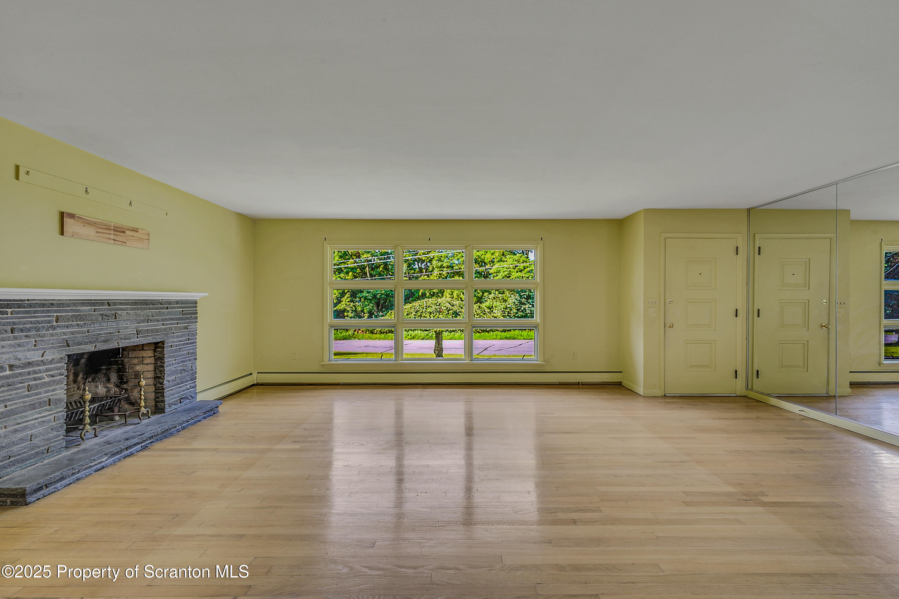 101 Old Post Road Clarks Summit, PA 18411 - Photo 9 of 48 a view of an empty room with a fireplace and a window