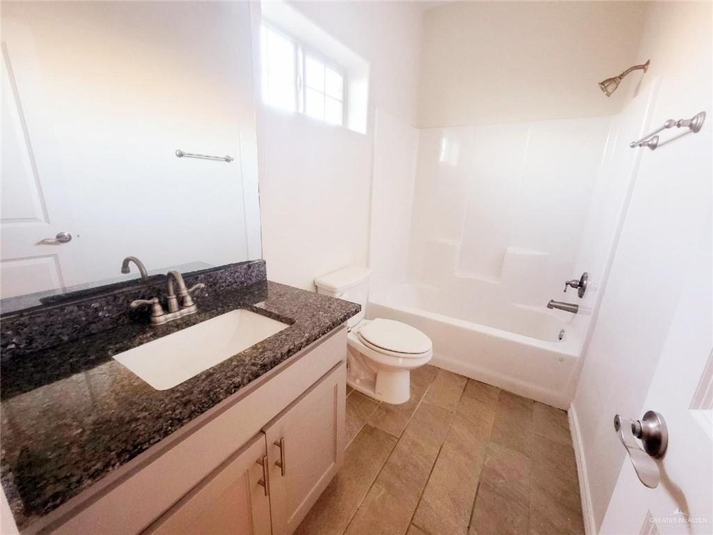 5601 Nightingale Avenue, Unit 2 McAllen, TX 78504 - Photo 11 of 12 Full bathroom featuring vanity and shower combination