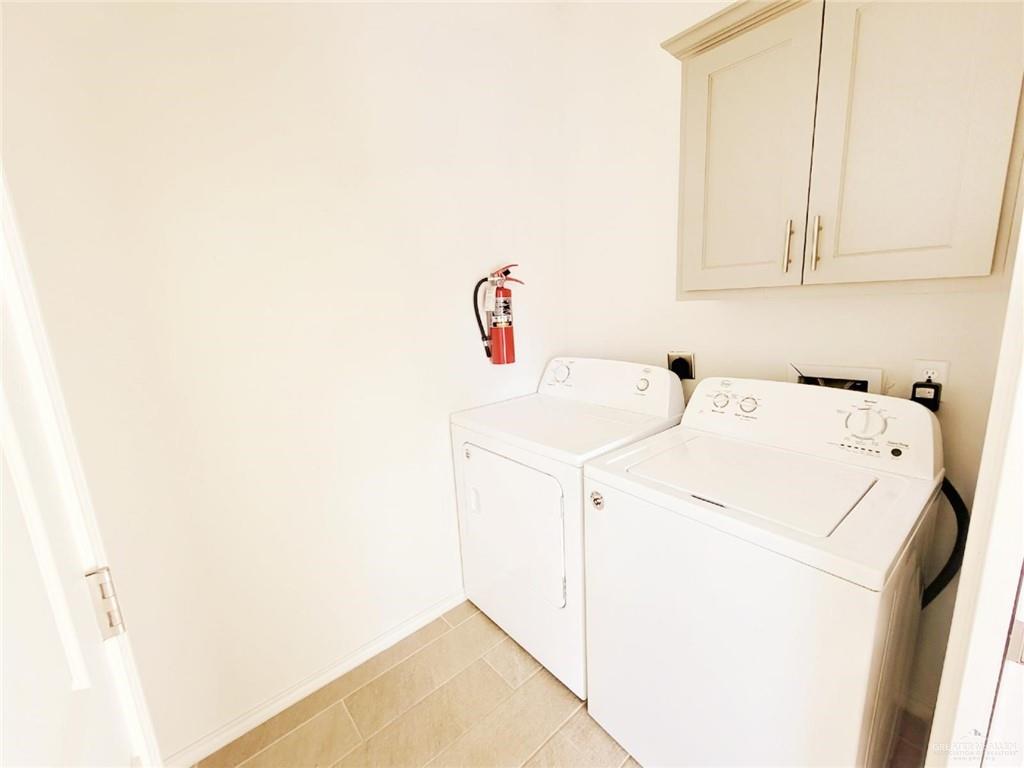 5601 Nightingale Avenue, Unit 2 McAllen, TX 78504 - Photo 10 of 12 Laundry area featuring cabinet space and washer and dryer