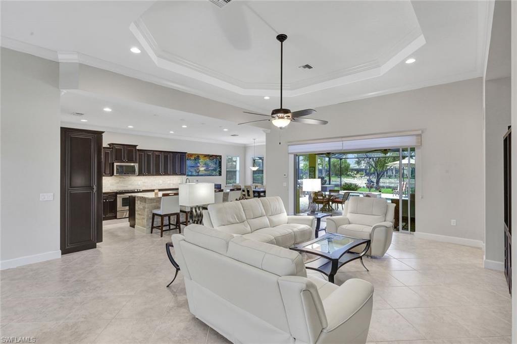 9111 Graphite Circle Naples, FL 34120 - Photo 11 of 33 a living room with furniture and a large window