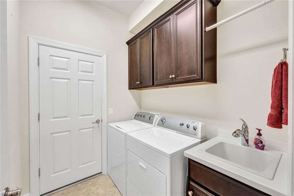 9111 Graphite Circle Naples, FL 34120 - Photo 20 of 33 a bathroom with a sink and a vanity