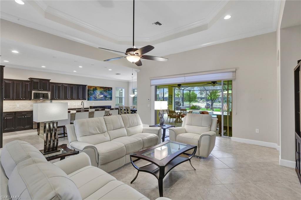 9111 Graphite Circle Naples, FL 34120 - Photo 8 of 33 a living room with furniture and a large window
